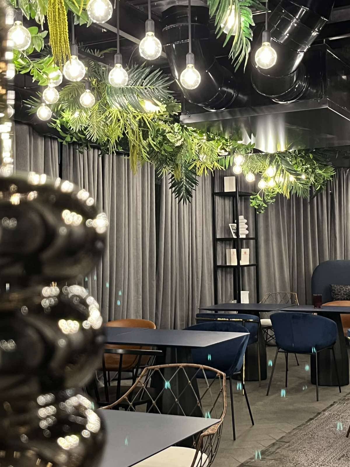 Decorative lighting and greenery at 042 Bar&Dinner